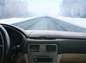 Snowy road over dashboard