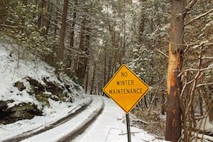 No Winter Maintenance sign on winter road